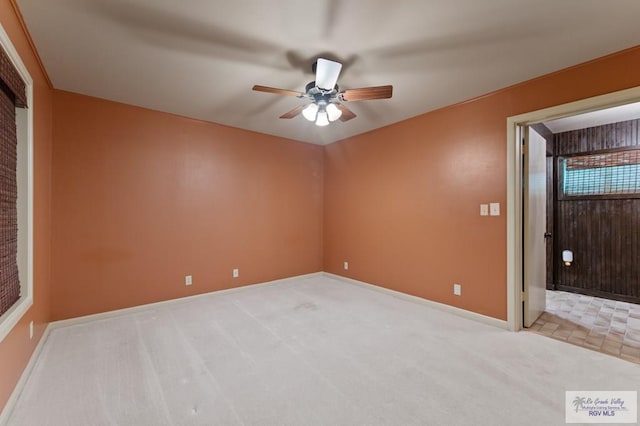 509 Lake Dr, Harlingen, TX 78550 - carpeted spare room with ceiling fan and baseboards