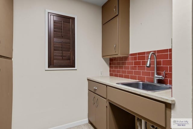 509 Lake Dr, Harlingen, TX 78550 - kitchen featuring light countertops and backsplash