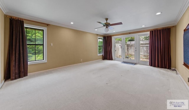 509 Lake Dr, Harlingen, TX 78550 - carpeted spare room featuring ornamental molding, plenty of natural light, a ceiling fan, and recessed lighting