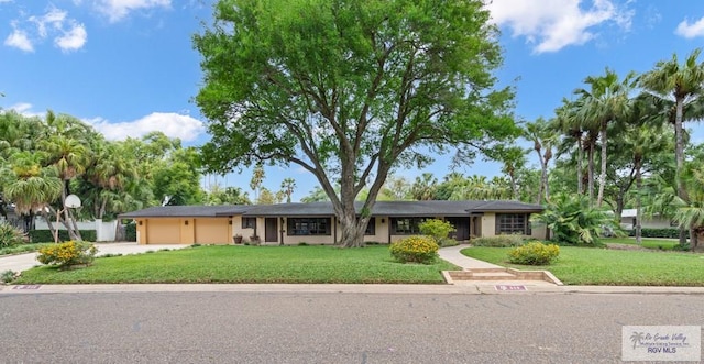 509 Lake Dr, Harlingen, TX 78550 - single story home with an attached garage, a front yard, and driveway