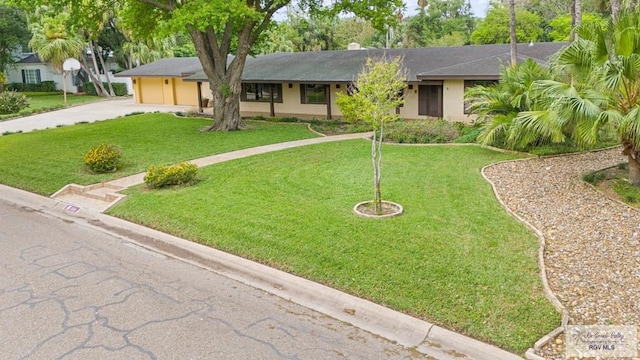 509 Lake Dr, Harlingen, TX 78550 - single story home with driveway, a garage, and a front yard