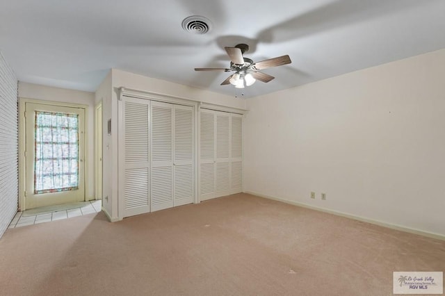509 Lake Dr, Harlingen, TX 78550 - unfurnished bedroom featuring carpet flooring and a ceiling fan
