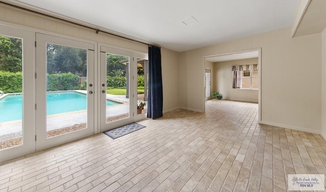 509 Lake Dr, Harlingen, TX 78550 - spare room with french doors and baseboards