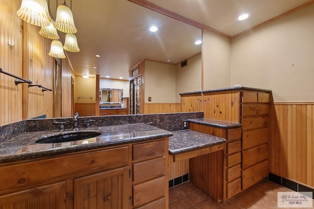 509 Lake Dr, Harlingen, TX 78550 - bathroom featuring tile patterned flooring, wooden walls, crown molding, recessed lighting, and wainscoting