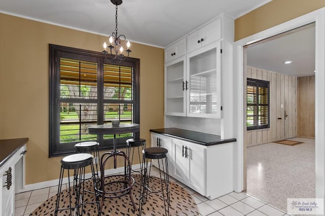 509 Lake Dr, Harlingen, TX 78550 - dining area featuring a chandelier and ornamental molding
