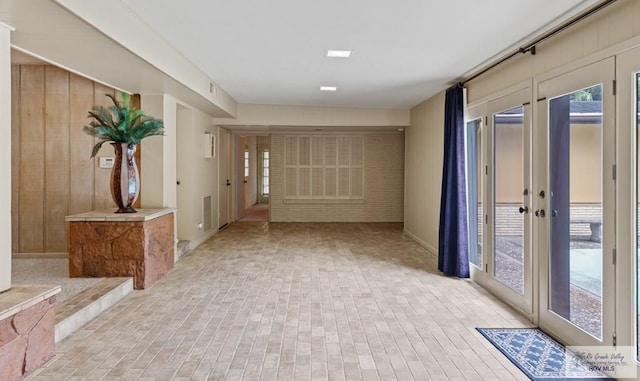 509 Lake Dr, Harlingen, TX 78550 - entryway with brick patterned floors and french doors