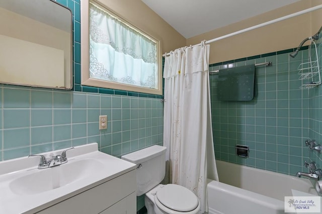 509 Lake Dr, Harlingen, TX 78550 - bathroom featuring vanity and shower / bathtub combination with curtain