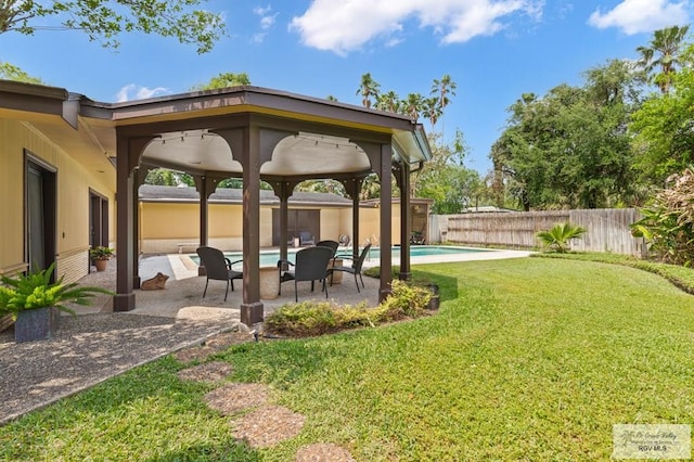 509 Lake Dr, Harlingen, TX 78550 - fenced backyard featuring a patio