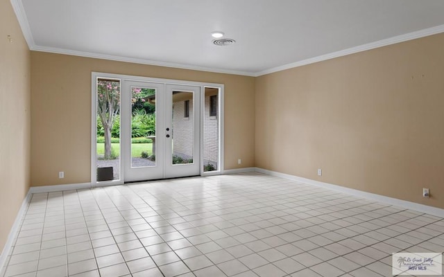 509 Lake Dr, Harlingen, TX 78550 - unfurnished room with crown molding, french doors, and light tile patterned floors