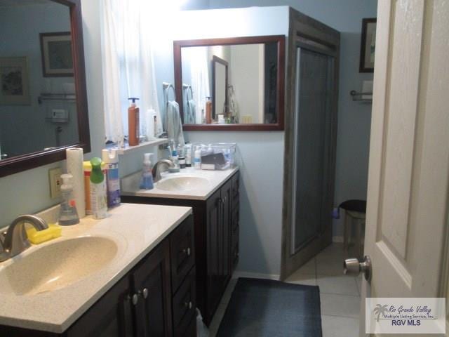 bathroom with tile patterned floors and sink