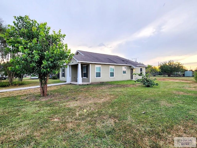 view of front of property with a yard