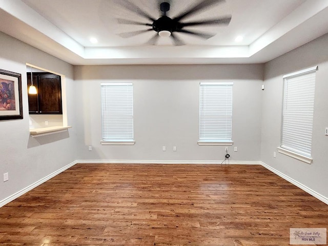 empty room featuring hardwood / wood-style flooring and ceiling fan