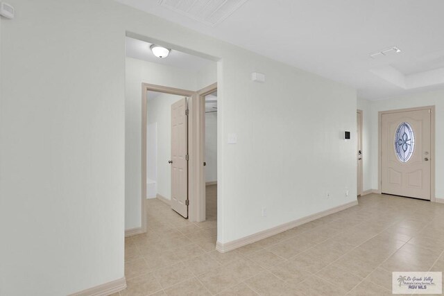 entryway featuring light tile patterned flooring