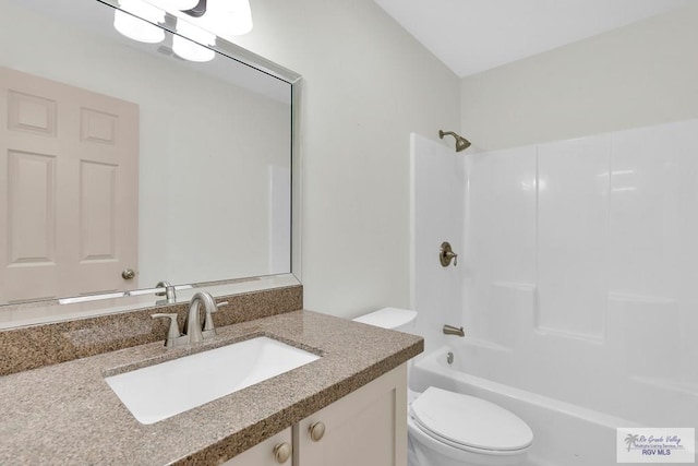 full bathroom featuring vanity, toilet, and bathtub / shower combination