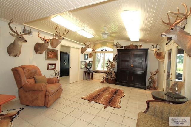 1914 S Parkwood Dr, Harlingen, TX 78550 - living room featuring tile patterned floors, wood ceiling, healthy amount of natural light, and a ceiling fan