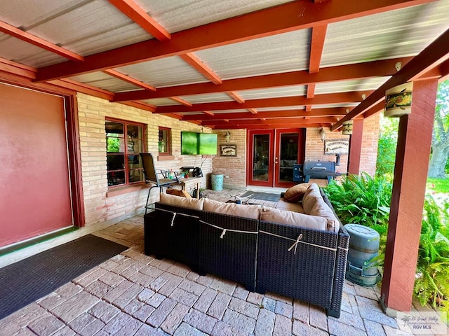 1914 S Parkwood Dr, Harlingen, TX 78550 - view of patio / terrace featuring outdoor lounge area