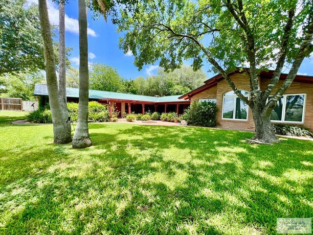 1914 S Parkwood Dr, Harlingen, TX 78550 - view of front of home featuring a front lawn