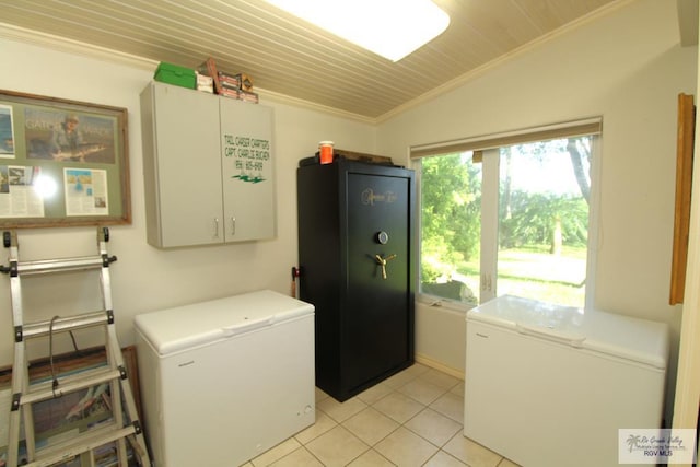1914 S Parkwood Dr, Harlingen, TX 78550 - washroom featuring washing machine and dryer, cabinet space, light tile patterned floors, crown molding, and wood ceiling
