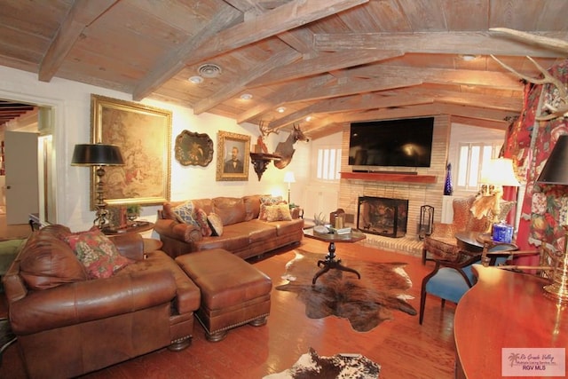 1914 S Parkwood Dr, Harlingen, TX 78550 - living area with wood finished floors, a fireplace, and wooden ceiling