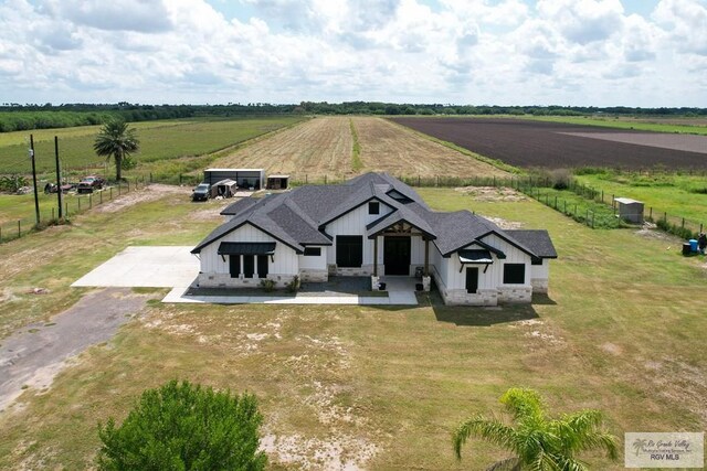 view of front of property with a rural view