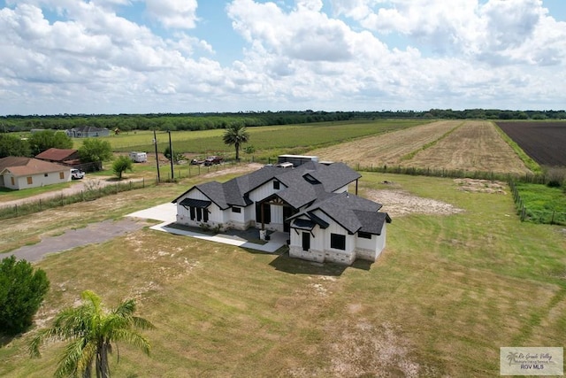 birds eye view of property featuring a rural view