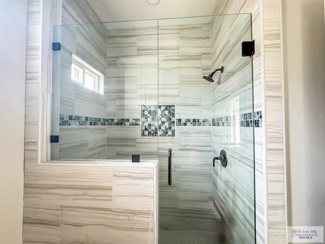 bathroom with an enclosed shower