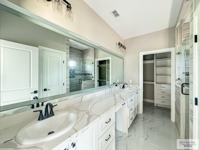 bathroom featuring vanity and walk in shower