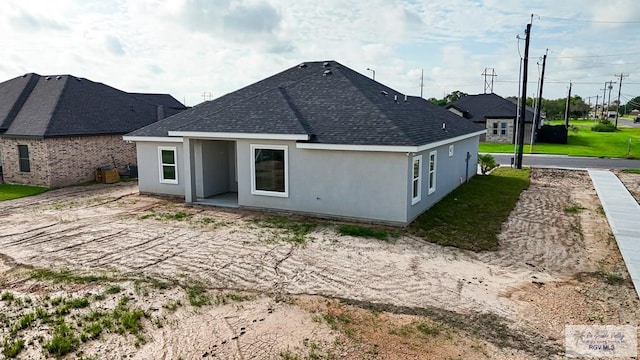 back of house with a patio