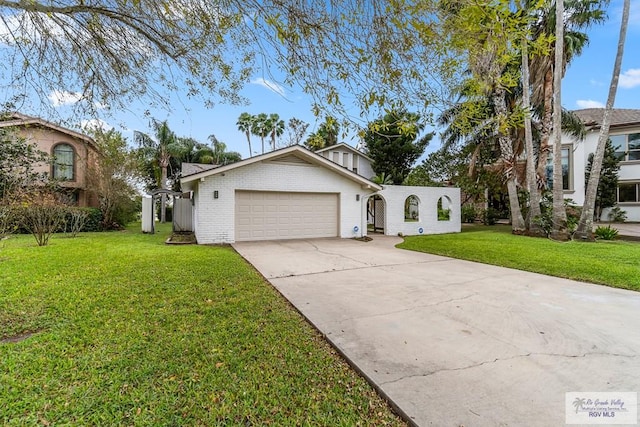 view of front of home with a garage and a front yard