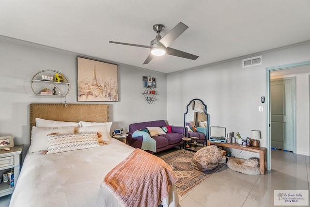 bedroom with ceiling fan, tile patterned flooring, and ornamental molding