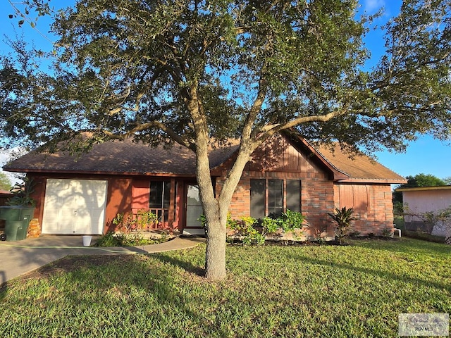 ranch-style house with a garage and a front lawn