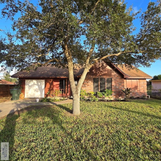 single story home with a garage and a front yard