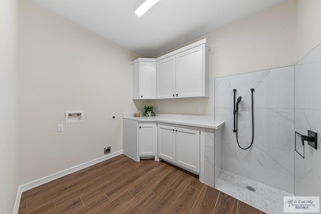 clothes washing area featuring hookup for a washing machine, baseboards, hookup for an electric dryer, cabinet space, and dark wood-style flooring