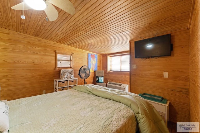 bedroom with ceiling fan, wooden ceiling, wooden walls, and an AC wall unit