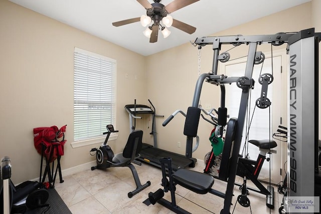 workout room with ceiling fan and light tile patterned floors