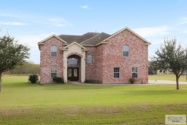 front of property featuring a front yard and french doors