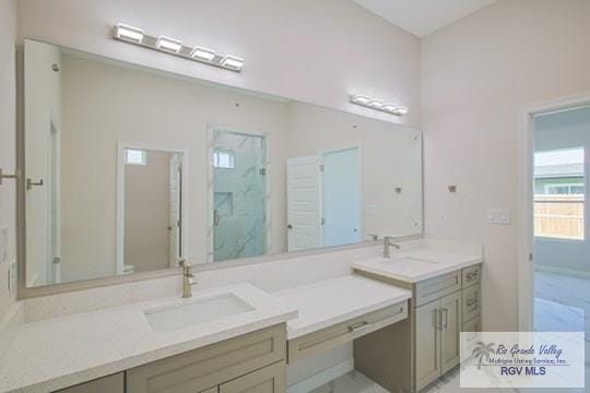 bathroom featuring vanity and a shower