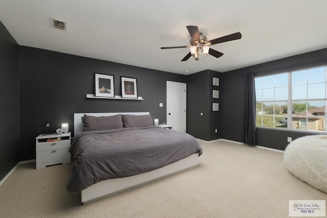 bedroom with visible vents, baseboards, and carpet floors