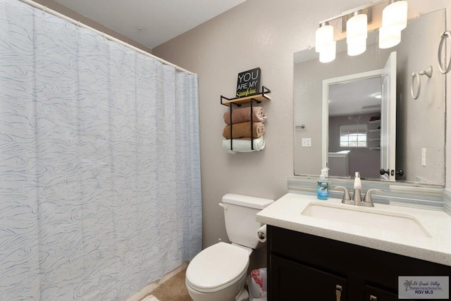 full bathroom featuring toilet and vanity