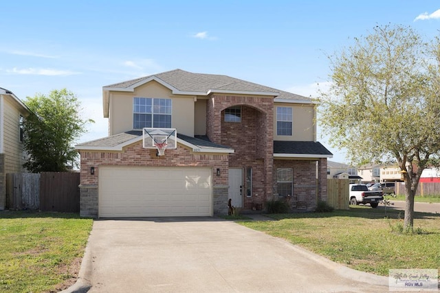 traditional-style home with fence, concrete driveway, a front yard, a garage, and brick siding