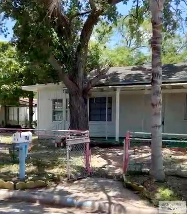 610 Charlotte St, San Benito, TX 78586 - view of front of home featuring roof with shingles