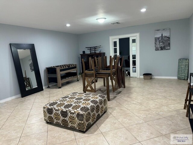 dining space with light tile patterned flooring