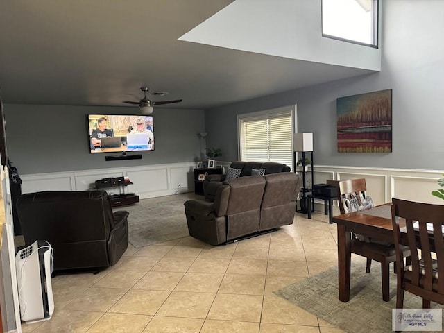 living room with ceiling fan and light tile patterned floors