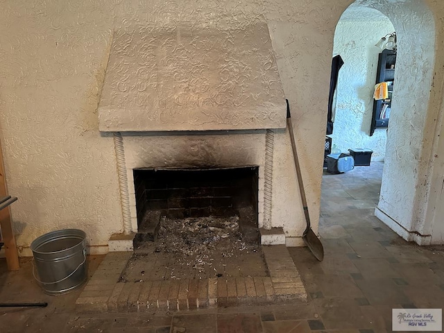 room details featuring a brick fireplace