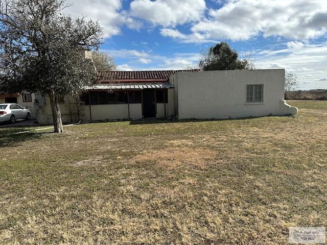 exterior space with a front yard