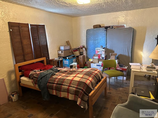 bedroom with a textured ceiling