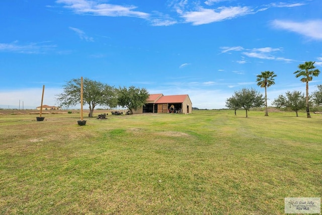 view of yard featuring an outbuilding and an outdoor structure