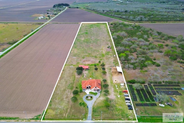 birds eye view of property with a rural view