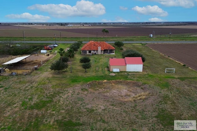 birds eye view of property with a rural view