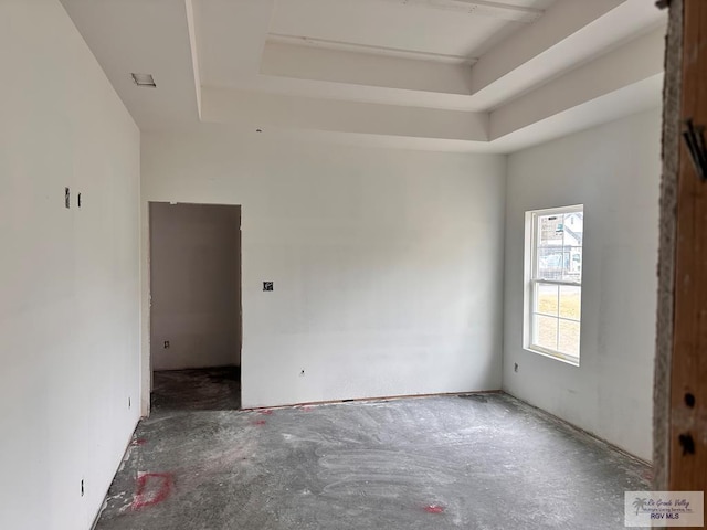 empty room with a tray ceiling